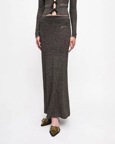 The Black and Gold Sparkle Rib Maxi Skirt by Ganni is a full length, rib knit skirt featuring an elasticated waistband and an embroidered Ganni logo crafted in a rib knit fabrication. Pair back to the matching cardigan for a coordinated suit. 34% Recycled Polyamide, 26% Organic Cotton, 18% Polyamide, 12% Wool, 8% MEPES, 2% Elastane Made in China #K2359 Rib Knit Skirt, Joseph Clothing, Long Skirts For Women, Straight Trousers, Gold Sparkle, Womens Size Chart, Engineered Garments, Knit Skirt, New Arrival Dress