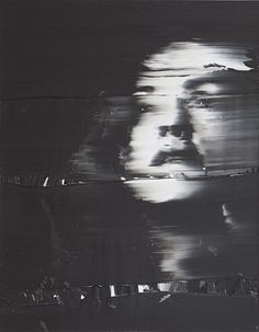 a black and white photo of a man's face