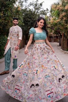 Indian couple dressed in coordinated outfits with colorful embroidery! Planning to host a Mehndi ceremony together as a couple? If yes, then what about the outfits? In case you wish to keep it as a surprise for each other then this article is not for you. However, if you've got no idea what to do, just keep scrolling. We spotted an old trend with a twist, wherein you only have to slay with your BAE in matching outfits, and voila.. simply create an effortless style statement. Couple Dandiya Dress, Matching Couple Outfits For Haldi, Trending Outfits Indian Wedding, Sangeeth Dress Couple, Couple Indian Outfits Matching, Couple Outfits For Haldi Ceremony