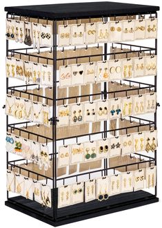 a display case with many pairs of earrings on it