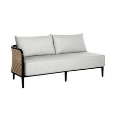 a white couch with two pillows on the back and one arm folded up to it's side