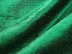 the green fabric is very soft and shiny, but it doesn't look like it has