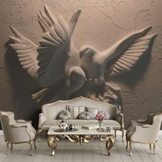 a living room with a couch, chairs and a wall mural in the background that has doves on it