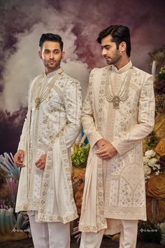 Make a grand statement on your special day with a luxurious Sherwani crafted from premium fabrics (like silk, brocade, or georgette) for ultimate comfort and sophistication. Our collection boasts a variety of designs to suit every taste: Classic elegance: Opt for a timeless Sherwani with intricate embroidery on the collar or cuffs. Modern flair: Go for a Sherwani with a unique neckline or a trendy color palette. Regal opulence: Choose a Sherwani with rich embellishments like zardozi work for a t Traditional Fit Sherwani For Wedding And Diwali, Traditional Fit Bandhgala For Wedding, Wedding Sherwani For Diwali, Traditional Sherwani For Festive Occasions, Traditional Fit Sherwani For Festive Occasions, Festive Sherwani With Traditional Fit And Drape, Embroidered Traditional Fit Sherwani For Wedding, Brocade Sherwani With Naqshi For Diwali, Traditional Fit Bandhgala With Cutdana For Wedding