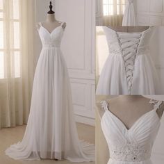 a white wedding dress on display in front of a window