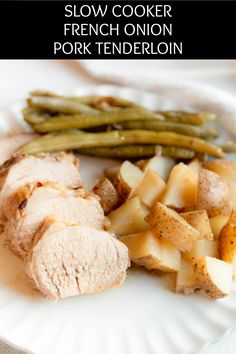 slow cooker french onion pork tenderloin on a paper plate with green beans and potatoes