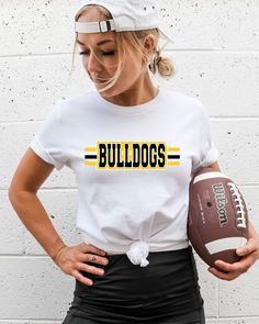 The bulldog is a popular mascot for schools and sports teams. Many people love to show their support for their beloved bulldog mascot by wearing t-shirts featuring their favorite bulldog heat transfer. Our Bulldog mascot t shirt transfers come in a variety of styles and designs, from simple and classic to bold and graphic. This design works well for both everyday wear and game day attire. Our heat transfers are made from high quality heat transfer material. You will be able to create t-shirts that your fans will love with these ready to press heat transfer designs. This design is perfect for fans who want to show their team spirit in a fun and playful way. Many bulldog mascot DTF transfers also feature bold graphics and typography, making them stand out in a crowd. Others feature motivatio White Mascot T-shirt For Football Season, School Spirit White T-shirt With Mascot, White Mascot T-shirt For Game Day, White School Spirit T-shirt With Mascot, White Sports Fan T-shirt With Mascot, White Mascot T-shirt For Fan Gear, White T-shirt With School Spirit Mascot, White Collegiate Mascot T-shirt, College Mascot T-shirt For Sports Fans