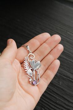 ITEM DESCRIPTION: The size H 5 cm x W 3 cm (2 x 1 inch). Weight - 4 g. You can buy it with a silver chain or without it. I made this unique Crocus pendant of sterling silver, dark amethyst, and moonstone. This is similar to the first spring flowers that appear from under the snow. The floral necklace looks so gentle and elegant! This handmade necklace will come to you in a gift box - ready for gifting. The parcel will be sent 1-2 days after payment. Delivery usually takes 10-21 days. But in the Unique Metal Flower Jewelry, Unique Flower-shaped Metal Jewelry, Unique Flower Shaped Metal Jewelry, Silver Flower Pendant Necklace For Mother's Day, Nature-inspired Flower Pendant Jewelry For Mother's Day, Metal Jewelry With Flower Charm And Pendant, Metal Flower Jewelry As Gift, Flower Shaped Metal Jewelry As Gift, Flower-shaped Metal Jewelry As Gift