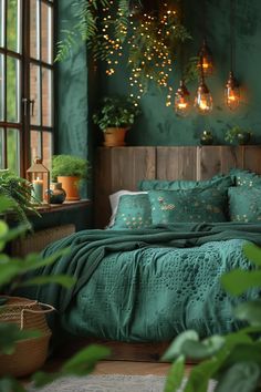 a bed with green sheets and pillows in a room filled with potted plants on the windowsill