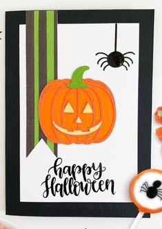 a halloween card with a jack - o'- lantern and candy