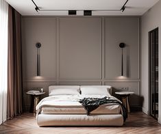 a large bed sitting in the middle of a bedroom next to two tables and lamps