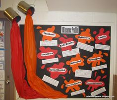 a bulletin board with orange and black writing on it