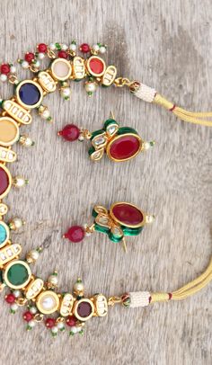 Kundan Navratan Necklace Earrings Studs Jewelry Set, Indian Party Wear Kundan Set, Wedding Necklace Jadau Punjabi Jewelry, Bridal Necklace Adorn yourself with these beautiful Navratan Necklace Earrings and look more beautiful. ITEM DESCRIPTION Metal = Gold Plated Occasion = Wedding, Party Wear, Bridal Color = Navratan Multi Stones Necklace Content = One Necklace Set and 2 Earrings/Studs Happy Buying :) Elegant Multicolor Bridal Sets For Festive Occasions, Elegant Multicolor Bridal Sets For Festivals, Kundan Necklaces For Marriage, Elegant Multicolor Kundan Necklace With Latkans, Festive Meenakari Bridal Earrings For Marriage, Festive Bridal Meenakari Earrings For Marriage, Festive Bridal Meenakari Earrings, Round Kundan Necklace With Latkans For Wedding, Round Kundan Necklace For Marriage And Festivals