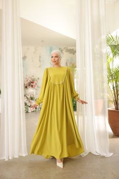 Indulge in timeless elegance with our Long Maxi Dress - Abaya - Available in 13 colors. Wedding Dresses For Eid, Elegant Solid Color Maxi Length Kaftan, Elegant Spring Abaya With Modesty Panel, Long Dress With Modesty Panel, Elegant Flowy Kaftan For Wedding, Eid Wedding Solid Color Abaya, Elegant Tunic Maxi Dress For Eid, Modest Long Dresses For Eid, Elegant Solid Color Dresses For Eid