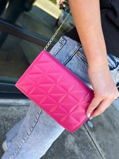 Introducing your new go-to accessory: the Chic Calling Cross Body Handbag! This magenta wonder adds a luxe touch to your look with a funky gold chain attachment, while also providing a pop of color to any outfit. It's like a fashion phone call you won't want to miss! Bag Height Bag Length Bag Width Strap Length 5.5 7.9 1.6 46.5 Trendy Pink Bag For Night Out, Trendy Clutch With Chain Strap, Trendy Clutch With Gold-tone Hardware, Chic Pink Clutch With Chain Strap, Chic Multicolor Clutch With Chain Strap, Magenta Handbag, Hot Pink Mcm Bag, Pink Clutch With Chain Strap, Neon Pink Crossbody Bag