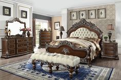 a bedroom with a large bed, dresser and mirror in the corner on top of carpeted flooring