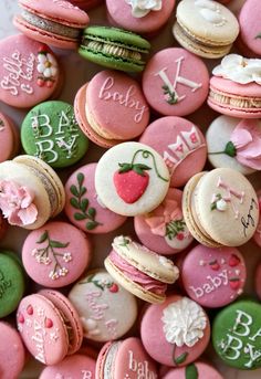 pink and green decorated macaroons with names on them