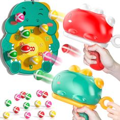 a child's hand holding a toy with various toys surrounding it