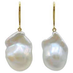 Indulge in the alluring grace of our Iridescent White Baroque Pearl Drop Earrings with 18K Yellow Gold French Hooks, crafted to captivate and inspire. These remarkable earrings feature stunning Freshwater Cultured Baroque Pearls, boasting a brilliant white hue that exudes timeless elegance. Each earring showcases a single Iridescent White Baroque Pearl with a combined weight of 37.50 carats. The pearls mesmerize with their distinct shapes and mesmerizing luster, measuring approximately 20.33mm x Luxury Teardrop Earrings With High Luster, Luxury High Luster Oval Earrings, Luxury Yellow Gold Drop Pearl Earrings, Luxury Pear-shaped High Luster Pearl Earrings, Elegant Drop Earrings With High Luster, Luxury High Luster Pear-shaped Pearl Earrings, Yellow Gold High Luster Drop Earrings, Elegant High Luster Drop Earrings, High Luster Drop Earrings