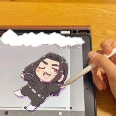 someone is drawing on an ipad with a pencil