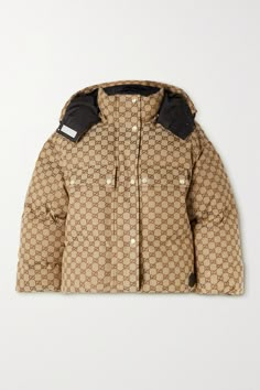 Gucci's jacket has been crafted in Italy from cotton-blend jacquard decorated with the label's signature 'GG' monogram. It's detailed with a leather tag punctuated by the logo and padded with insulating down. Protect yourself from the elements by adjusting the drawcords and attaching the hood. Gucci Winter Jacket, Fendi Winter Jacket, Gucci Jacket Women Outfit, Gucci Outfits Women Casual, Gucci Jacket Women, Gucci Puffer Jacket, Gucci Clothes Women, Gucci Winter, Chocolate Collection