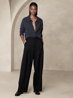 Sophisticated and decadent, this exceptionally tailored pant is crafted from our best-selling Italian stretch-wool with elegant double pleating at the front to enhance its wide-leg silhouette.  Relaxed Wide-Leg Fit: Super high waisted.  Relaxed fit from hip to thigh, voluminous leg.  Full length.  Fabric from Italy's Marzotto mill.  Internal button-tabs at the waistband adjust from high-rise to ultra-high rise.  Zip fly with hook-and-bar closure.  Belt loops.  Front and back pockets.  Unlined. Black Pants Aesthetic, Wide Leg Trousers Outfit, Banana Republic Pants, Banana Republic Women, Petite Shorts, Winter Outfits For Work, Wool Pants, Bottom Clothes, Wide Leg Trousers