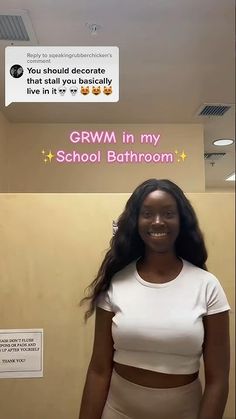 a woman standing in front of a sign that says grawm in my school bathroom