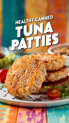 healthy canned tuna patties on a plate with tomatoes and lettuce