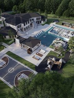 an aerial view of a large house with a basketball court and pool in the backyard