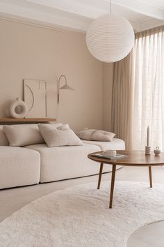 a living room filled with furniture and a white rug