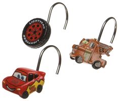 three different toy cars hanging from hooks