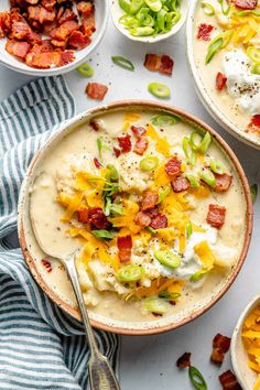 two bowls filled with potato soup and bacon