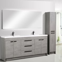 a bathroom vanity with two sinks and a large mirror above it, along with a walk in shower