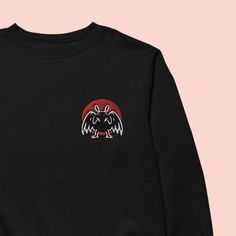 One of our favorite cryptids, MOTHMAN! 💀 FREE SHIPPING ON USA ORDERS OVER $35 💀 * High quality embroidery * Unisex, women may want to size down * 65/35 cotton/polyester * Pre-shrunk Casual Sweatshirt With Front And Back Print, Casual Long Sleeve Sweatshirt With Front And Back Print, Casual Sweatshirt With Long Sleeves And Front-back Print, Casual Sweatshirt With Long Sleeves And Prints, Black Long Sleeve Embroidered T-shirt, Cotton Sweatshirt With Front And Back Print, Embroidered Crew Sweater For Streetwear, Black Cotton Sweater With Embroidered Graphics, Winter Cotton Sweatshirt With Front And Back Print