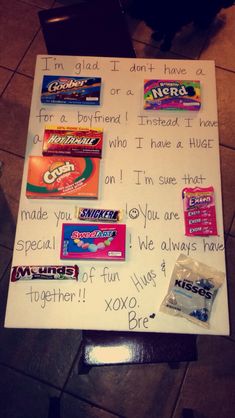 a white board with candy on it that says i'm glad i don't have a girlfriend