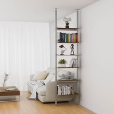 a living room filled with furniture and bookshelves next to a white curtained window