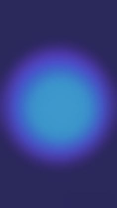 a blurry image of a blue circle on a purple background with space for text