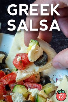 a hand is picking up some food from a plate with the words greek salsa on it