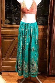 Sequined Embroidery GreenGold Painted Long Maxi Skirt, Bohemian Boho Chic Festival Ethnic Hippie Summer Sparkle One Size Feminine Long Skirt. Crochet or tie dye top is not included. You will feel so good in this gorgeous skirt. Beautiful Long Maxi skirt hand embroidery, hand sequined gold painted and it sparkles so each skirt is unique and one of a kind. This rayon Green skirt is made using soft light and beautiful rayon fabric. Rayon was the first manufactured fiber. The term rayon was official Boho Long Skirt, Maxi Rock, Hippie Summer, Skirt Crochet, Festival Pants, Long Maxi Skirt, Boho Chic Dress, Embroidery Hand, Long Maxi Skirts