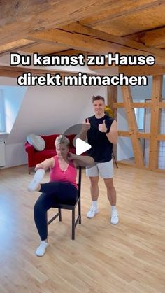 a man and woman are doing exercises in the living room while another person is sitting on a chair