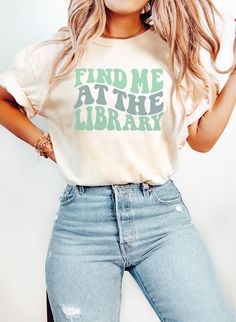 Find Me At The Library Shirt, Librarian Shirt, Comfort Colors Librarian Shirt, Librarian Gift, Gift for Librarian, Book Lover Gift, Book Tee PRODUCTION TIME: 1-5 days (Typically 2 days) A little longer during the holiday season. SHIPPING TIME: 2-5 days (Typically 3 days) A little longer during the holiday season. PRODUCT DESCRIPTION: Comfort Colors is a garment-dyed t-shirt. A fully customizable tee made 100% with ring-spun cotton. The soft-washed garment-dyed fabric brings extra cosiness to you Screen Print Short Sleeve Tops, Literary Style Short Sleeve Screen Print Tops, Literary White Cotton Tops, White Cotton Literary Tops, Library Shirt Ideas, Librarian Shirts Elementary, School Librarian Tshirts, Library Tshirt, Library Shirt