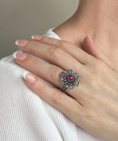 Elevate your femininity with this exquisite lace daisy flower design 925 Sterling silver ring featuring a stunning opaque Ruby corundum gemstone. This versatile piece is perfect for daily wear and is an ideal accessory for special occasions such as weddings, engagements, proms, and other celebrity events. The elegant and intricate design also makes it a perfect gift option for holidays, birthdays, Christmas, mother`s day, and any other special occasion. Crafted with exceptional attention to deta Elegant Silver Ruby Flower Ring, Victorian Filigree Promise Ring, Round Filigree Ring With Gemstone, Ornate Filigree Ring For Promise, Ornate Filigree Promise Ring, Flower Shaped Ring With Center Stone, Flower-shaped Ring With Center Stone, Filigree Ring With Center Stone As Gift, Gift Filigree Ring With Center Stone