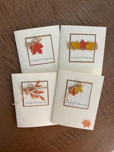 four greeting cards with autumn leaves on them