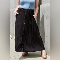 This Beautifully Crafted Skirt Combines Sophistication And Playfulness, Making It A Perfect Choice For Various Occasions. The Midi Length Of This Skirt Offers A Classic And Timeless Silhouette That Flatters All Body Types. It Falls Gracefully Below The Knee, Creating An Elegant And Feminine Look. Whether You're Attending A Formal Event, Going Out With Friends, Or Simply Want To Elevate Your Everyday Style, This Skirt Will Effortlessly Elevate Your Outfit. One Of The Standout Features Of This Ski Versatile Black Skirt For Day Out, Flowy Black Maxi Skirt For Day Out, Black Maxi Skirt, Fashion District, Printed Maxi Skirts, Cargo Skirt, Feminine Look, Urban Outfits, Chic Boutique