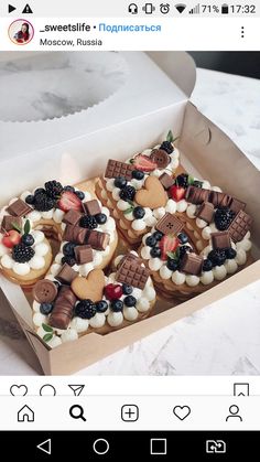 a box filled with lots of different types of cookies