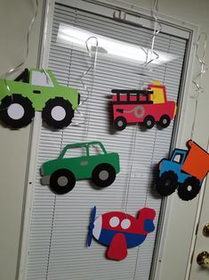 the door is decorated with cars and trucks