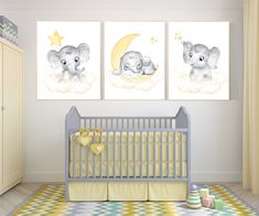 a baby's nursery room with two elephant pictures on the wall