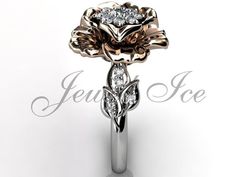 a rose shaped diamond ring with leaves on it