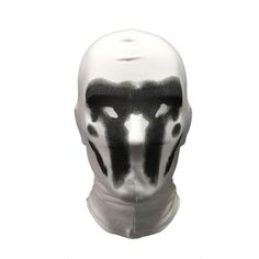 a white mask with black paint on it