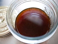 a jar filled with liquid sitting on top of a table